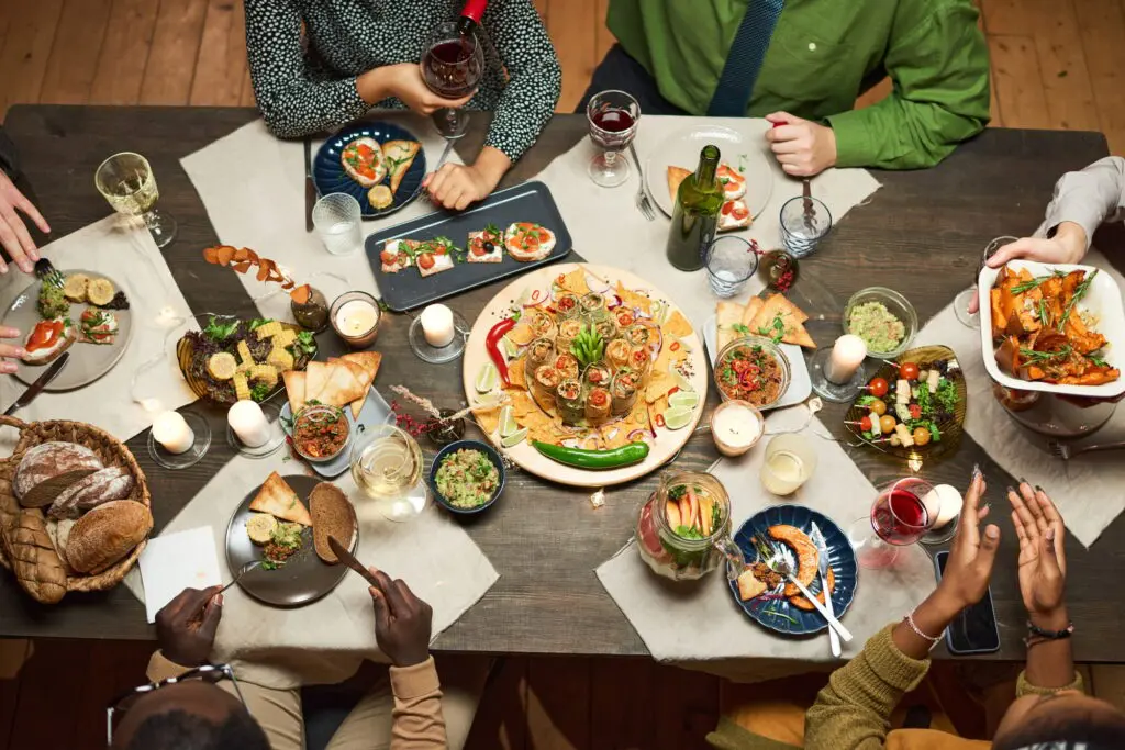 Dining table with dish and appetizers